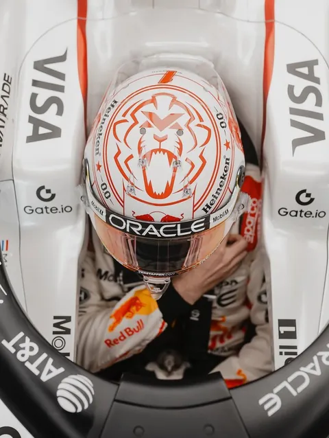 Looking down into the cockpit, the white and red helmet framed by the halo.